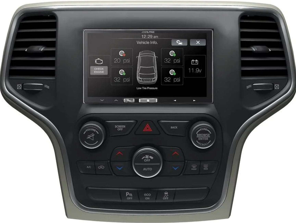 iDatalink KIT-JGC1 installed in Jeep Grand Cherokee showing Alpine head unit displaying vehicle info screen with tire pressure, check engine, and battery voltage data via Maestro integration
