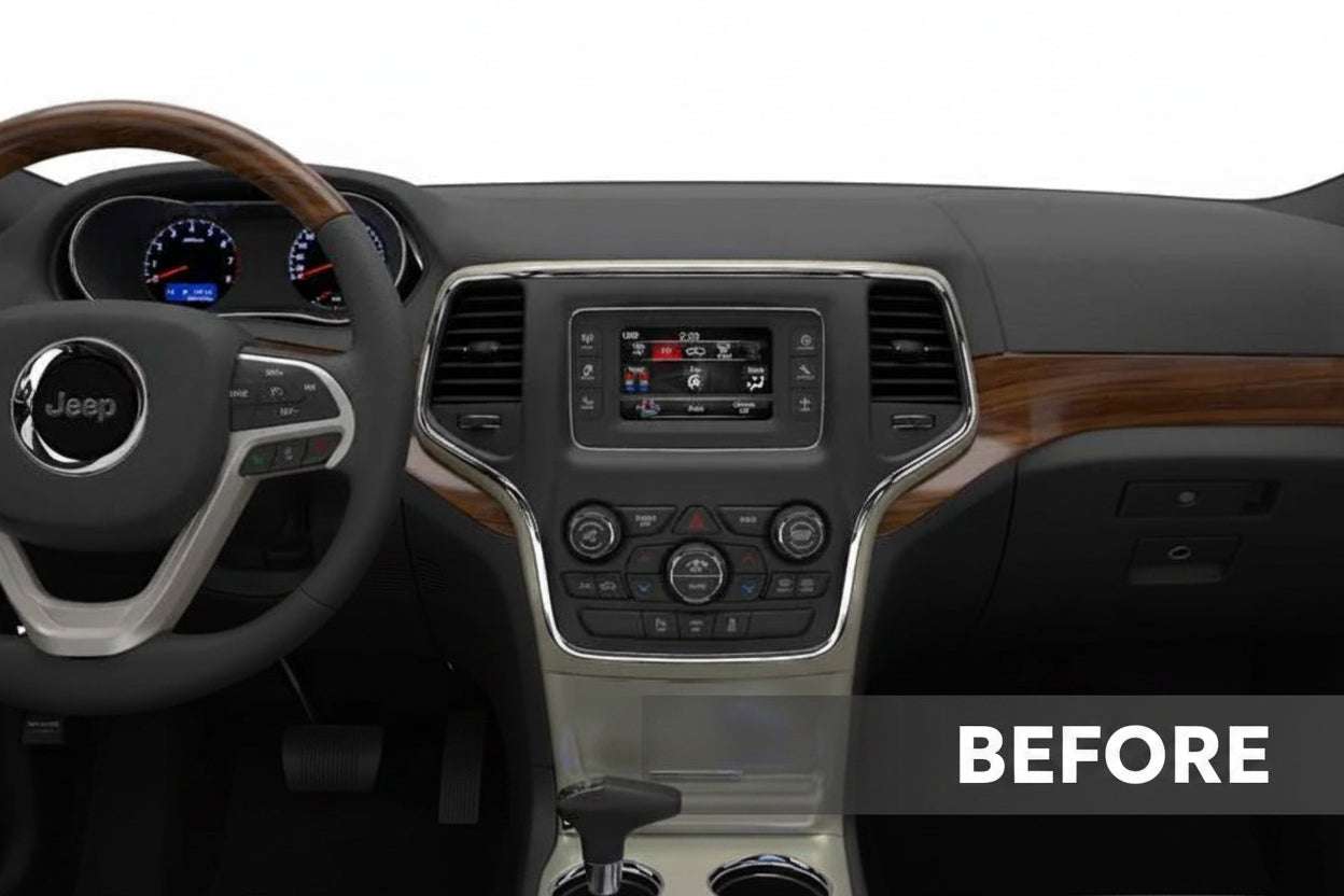 Jeep Grand Cherokee factory dashboard before aftermarket radio installation showing OEM infotainment screen and climate controls