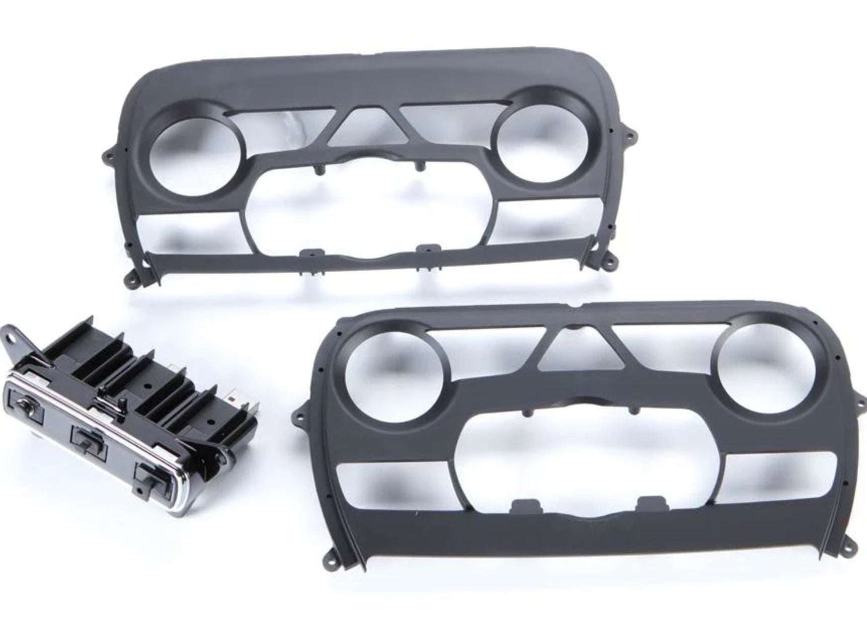 iDatalink KIT-JGC1 included dash kit components showing two gray ABS dash bezels and factory-style HVAC climate control module for Jeep Grand Cherokee
