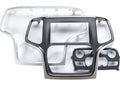 iDatalink KIT-JGC1 included dash components showing large silver and black Jeep Grand Cherokee radio surround bezel, inner chrome-trimmed head unit bezel, and black dual HVAC knob control module