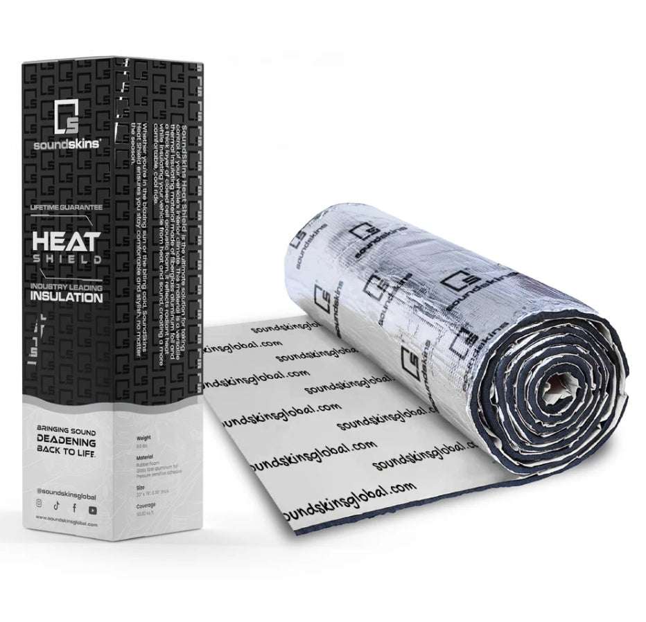 SoundSkins SSK-HTSHLD Heat Shield sound deadening kit showing black retail box with SoundSkins logo, Lifetime Guarantee, Heat Shield, and Industry Leading Insulation labels alongside partially unrolled silver fiberglass aluminum foil and rubber foam roll
