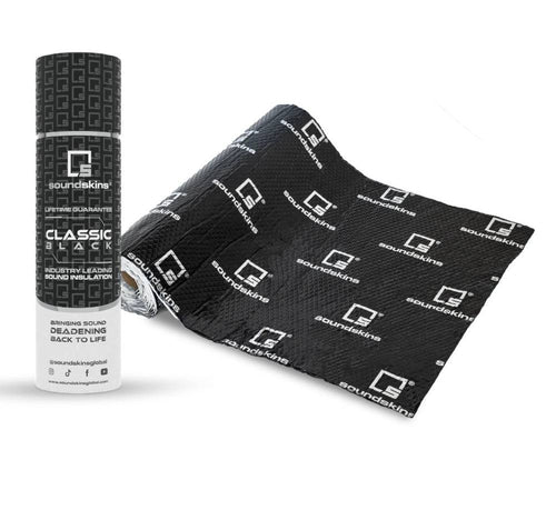 SoundSkins Classic Black sound deadening kit showing cylindrical tube packaging with Classic Black label, Lifetime Guarantee, and Industry Leading Sound Insulation alongside unrolled black butyl deadening sheet with SoundSkins logo pattern