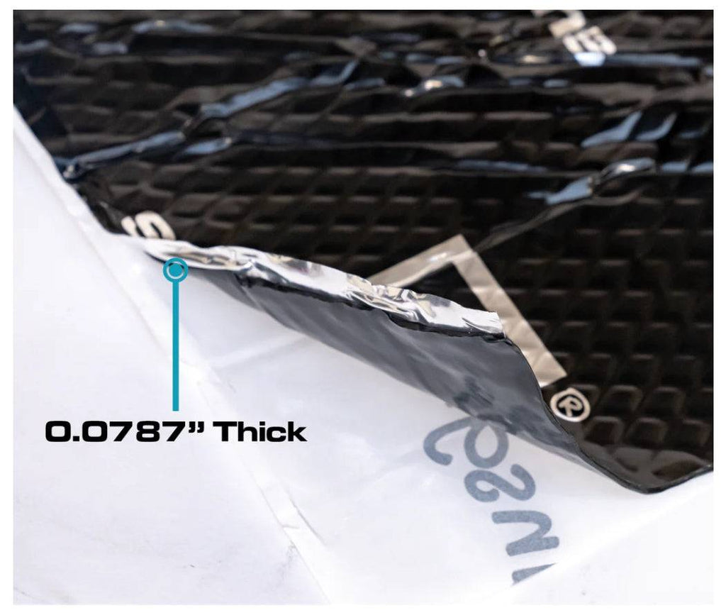 SoundSkins Classic Black sound deadening sheet close-up edge cross-section showing black diamond-embossed butyl top layer, aluminum foil middle layer, and white backing sheet being peeled with 0.0787 inch thickness callout