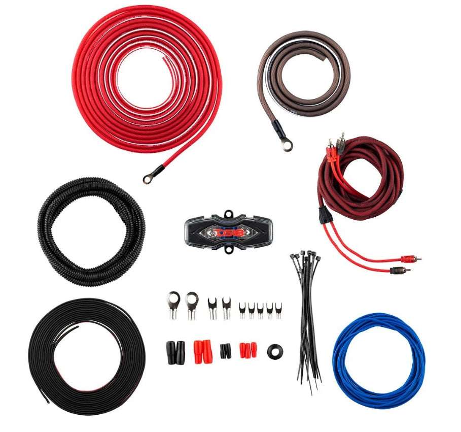 DS18 OFCKIT8 8-gauge OFC amplifier wiring kit components flat lay showing red OFC power cable, brown OFC ground cable, red, black braided RCA cable with RCA connectors, blue remote wire, corrugated loom tube, black speaker wire, DS18 ANL fuse holder, ring terminals, fork terminals, butt connectors, rubber grommet, and zip ties