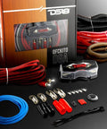 DS18 OFCKIT0 0-gauge OFC amplifier wiring kit lifestyle shot showing retail box, 17-ft red OFC power cable, black loom tube, ANL fuse holder, blue remote wire, red, black twisted RCA cable, ring terminals, butt connectors, fork terminals, zip ties, and rubber grommet