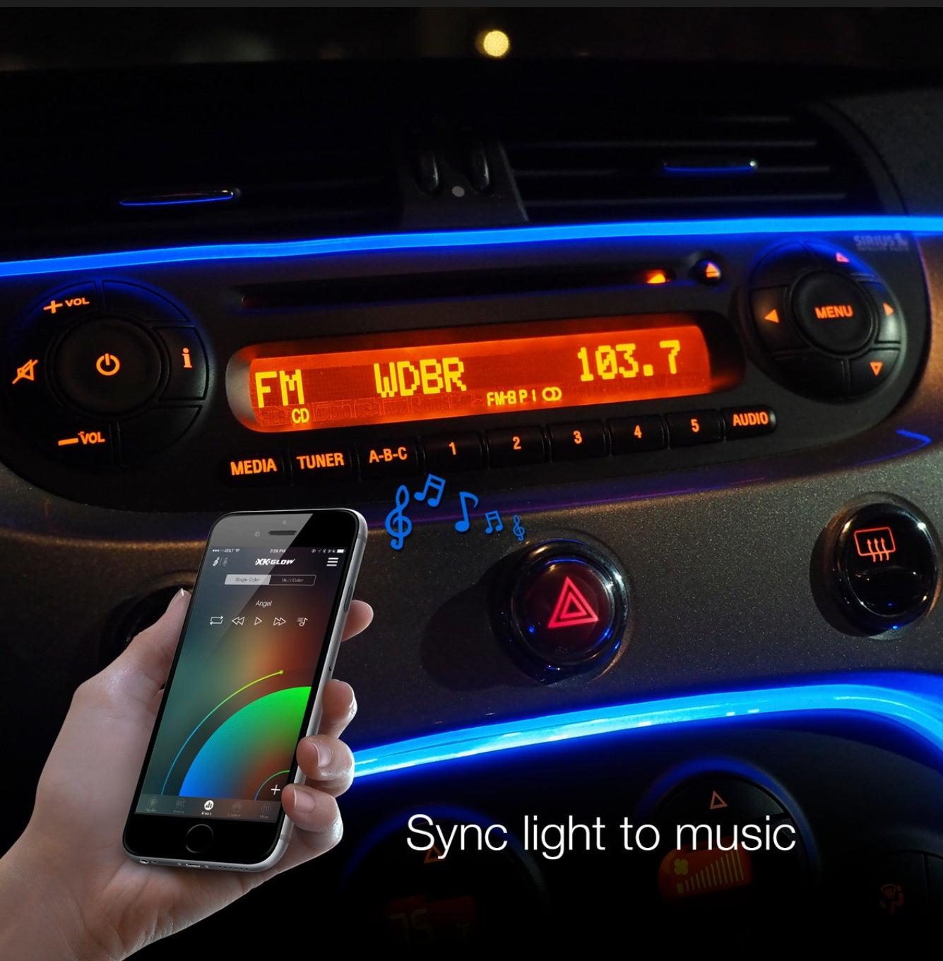 A hand holds a smartphone in front of a car dashboard, with blue LED ambient lighting synchronized to the phone's music display. The dashboard features illuminated controls, an orange radio screen, and the text 'Sync light to music' at the bottom.