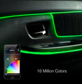 Green LED car door panel ambient light illuminated around the handle and armrests, shown on a black car interior with a smartphone app control overlay and text reading '16 Million Colors'.