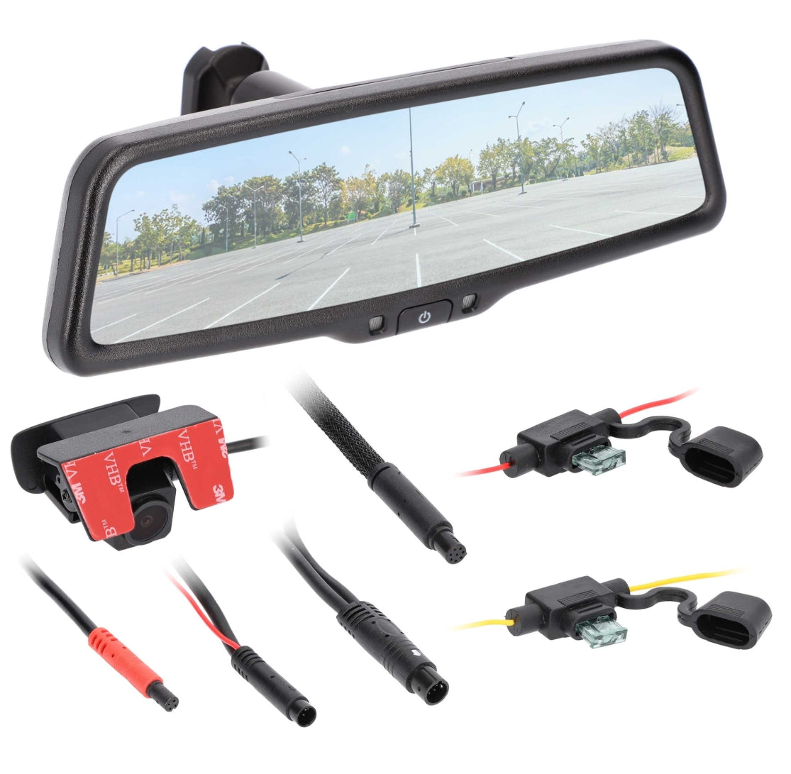 A rearview mirror car camera kit with a rectangular black mirror showing a parking-lot scene, plus mounting hardware, cables, and connector plugs on a white background.