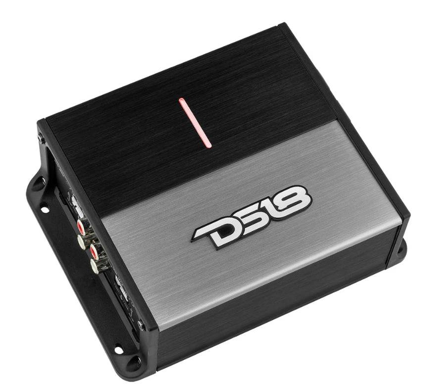 DS18 ION1000.4D 4-channel mini amplifier angled front view showing black brushed aluminum heatsink lid with red power LED indicator stripe, DS18 logo brushed silver face panel, RCA inputs and crossover controls on signal input panel, and black corner mounting tabs