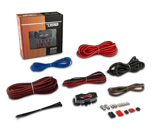 DS18 OFCKIT8 8-gauge OFC amplifier wiring kit complete contents flat lay showing retail box, red OFC power cable with ring terminal, brown OFC ground cable, red, black braided RCA cable, blue remote wire, corrugated loom tube, split loom, DS18 ANL fuse holder, zip ties, ring terminals, fork terminals, butt connectors, and rubber grommet